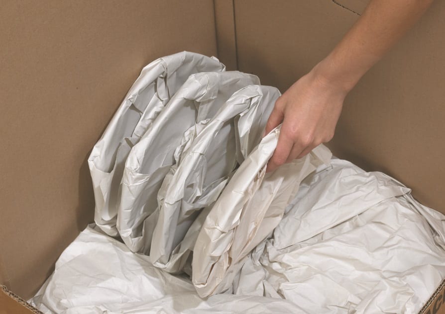 Efficient Moving Services packing dishes