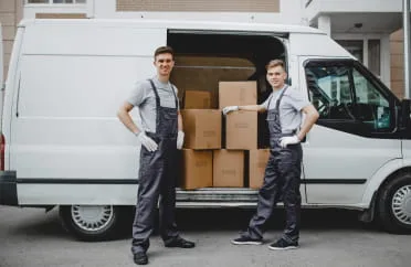 Long-distance movers loading a moving truck in Massachusetts