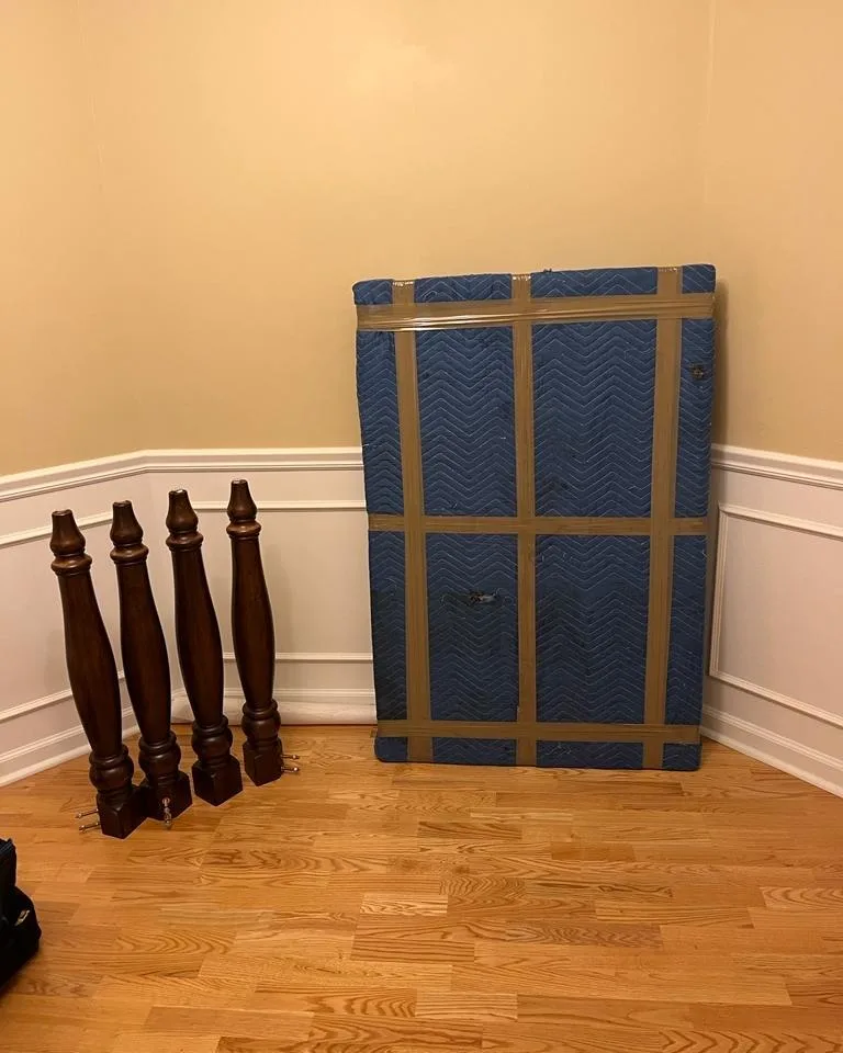 Professional movers handling furniture with care during a home move